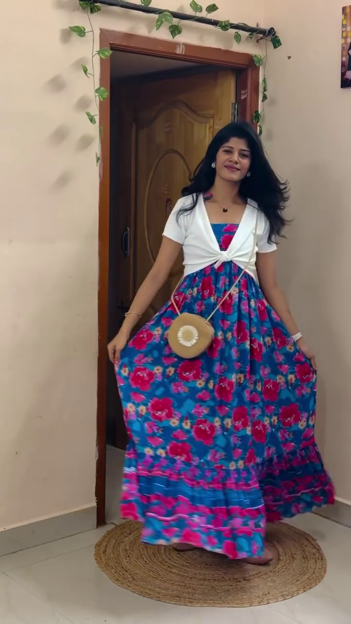 Effortlessly Stylish Summer Look with This Floral Maxi Dress and Chic Layered White Shrug Combo