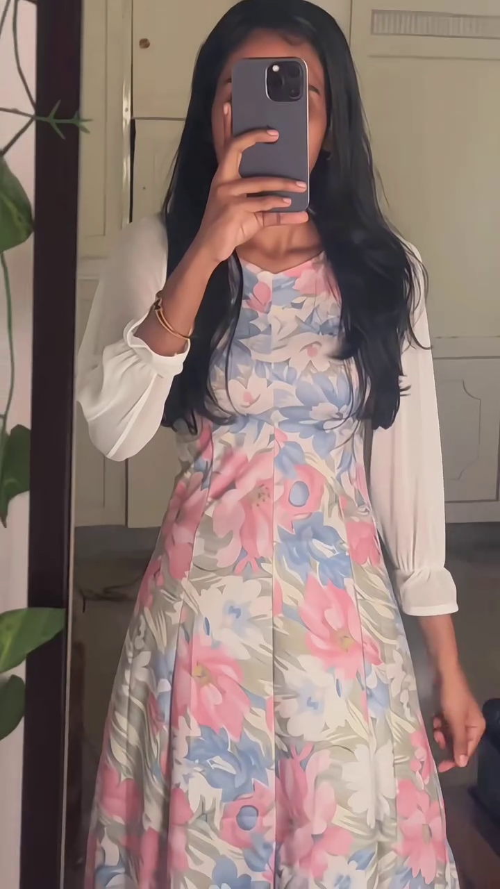 Soft Feminine Charm Meets Everyday Elegance in This Pastel Floral Midi Dress with a Graceful Layered Look
